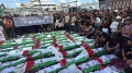 تشييع جثامين 100 شهيد فلسطيني في حي الزيتون